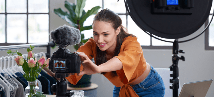 A girl setting up her camera to film content